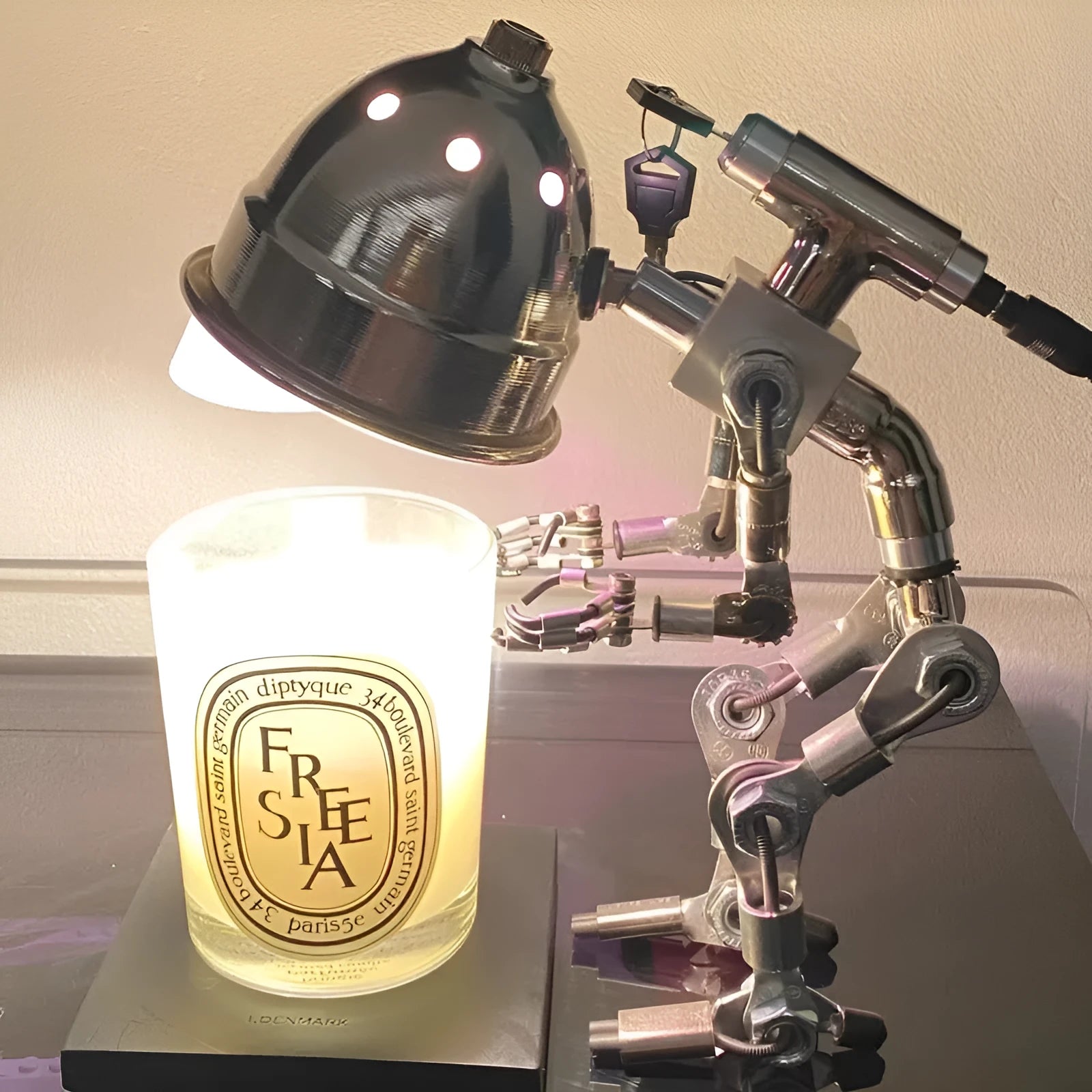 Silver and copper robot night lights showing 22cm and 29cm size options with customisable graphics