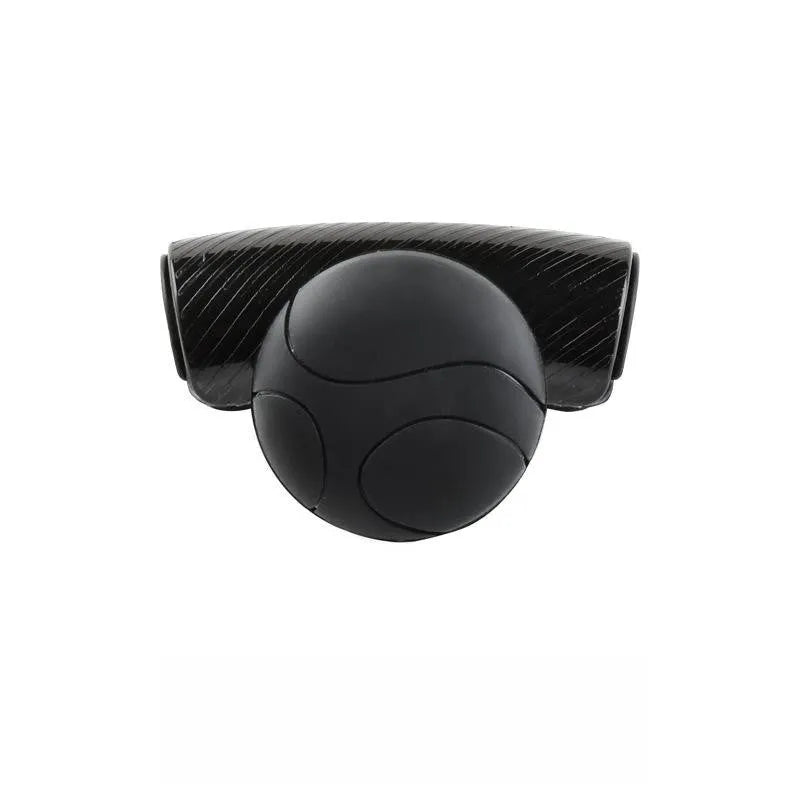Black silicone steering wheel assist ball with metal bearing on a car steering wheel.
