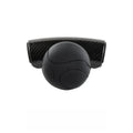 Black silicone steering wheel assist ball with metal bearing on a car steering wheel.