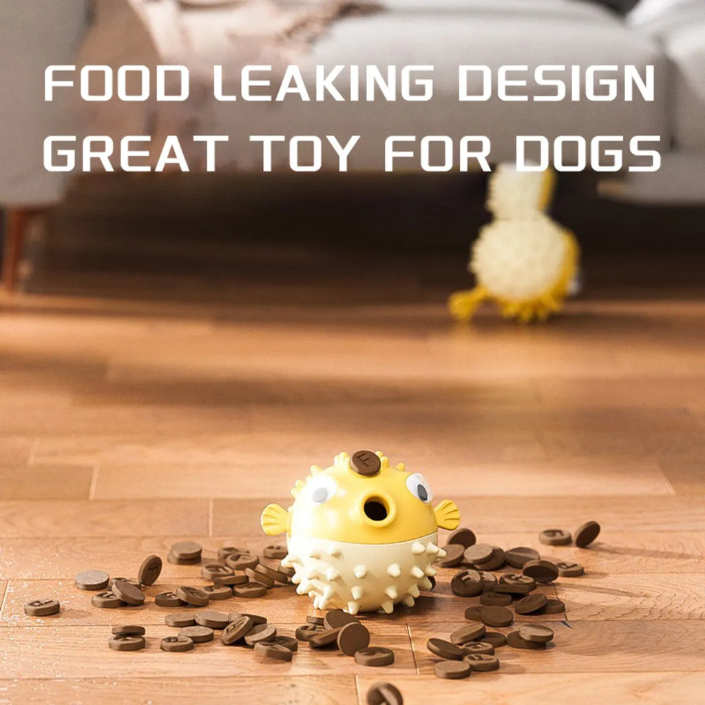Yellow fish-shaped vinyl dog chew toy with textured surface and squeaker.
