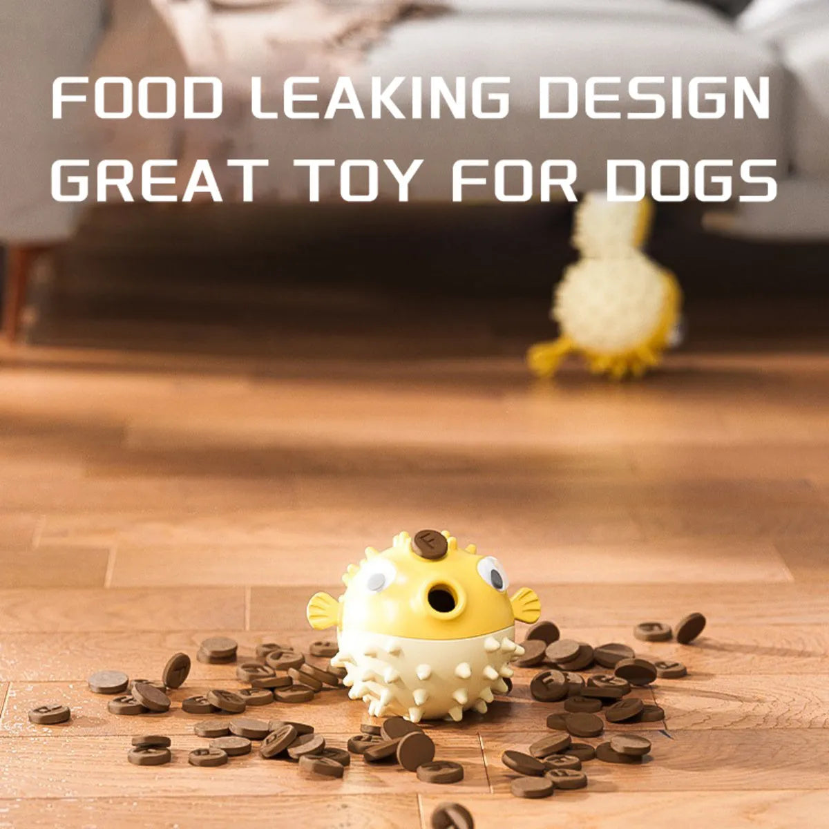 Yellow fish-shaped vinyl dog chew toy with textured surface and squeaker.