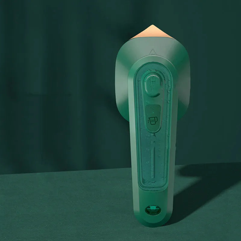 Handheld portable garment ironing machine in dark green with large titanium panel, UK plug