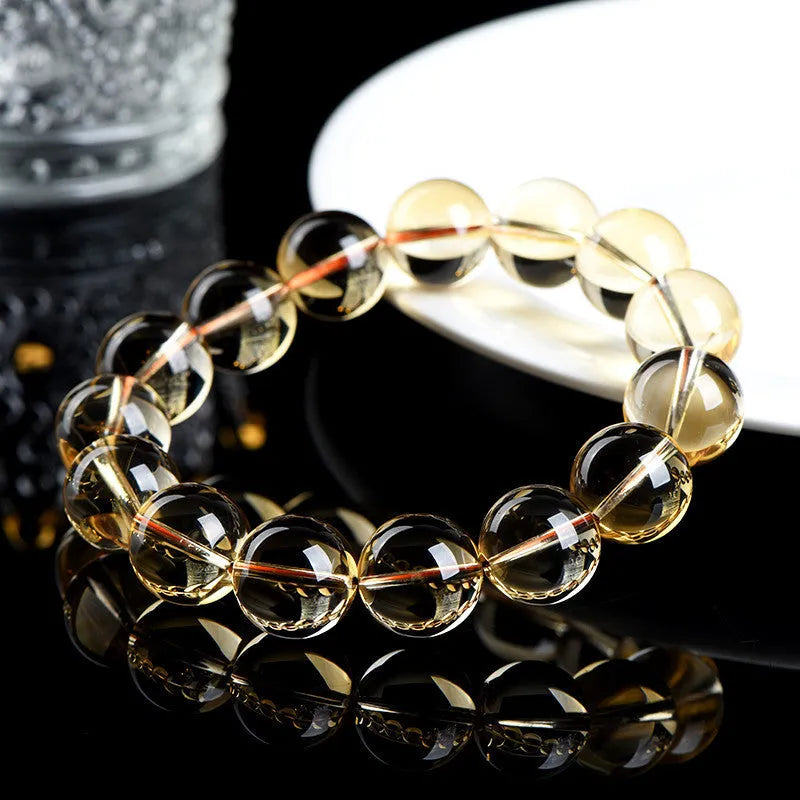 Natural citrine scattered bead bracelet in 7A or 6A grade on a wrist, showing five size options.