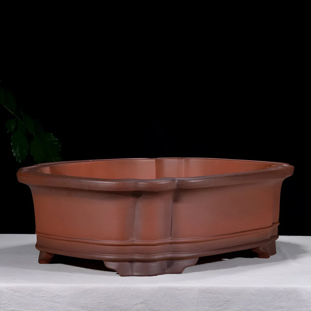 Large antique Chinese style purple clay flower pot with tree stump design and decorative botanical relief