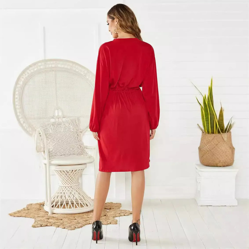 Black A-line dress with elastic waist, long sleeves with elastic cuffs and matching belt