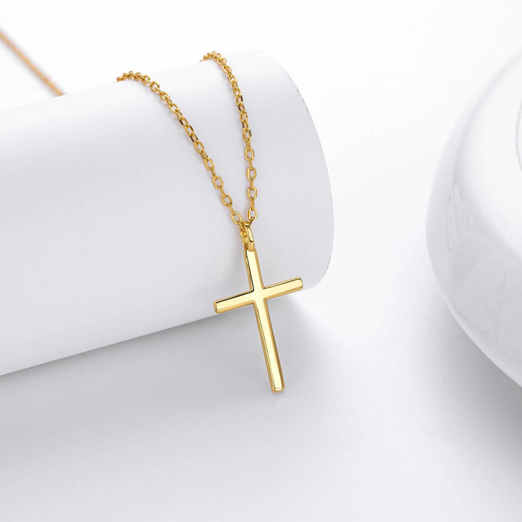 Simple glossy cross pendant on a sterling silver O-chain necklace.