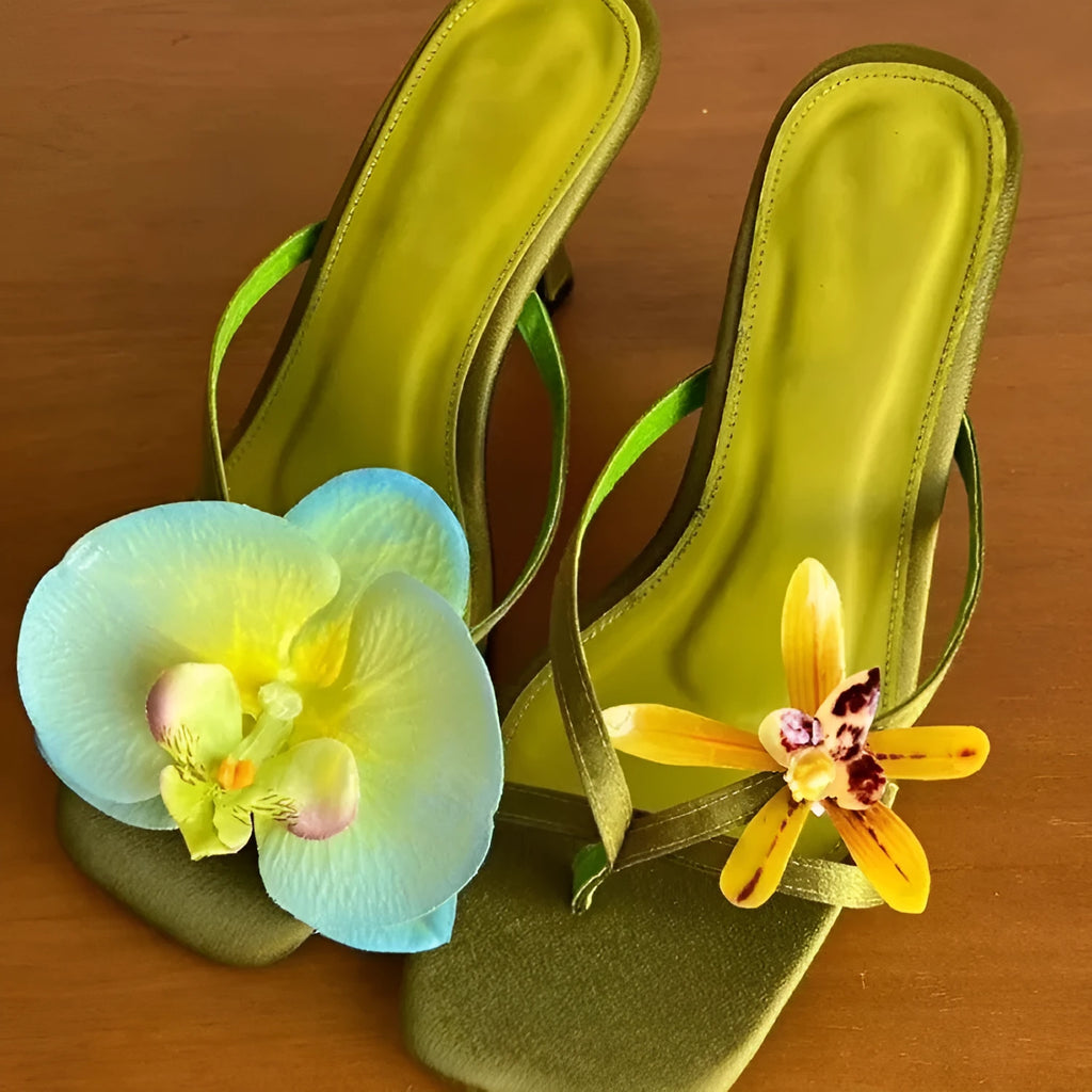 Handmade women's high heel semi-slipper sandals with asymmetric flower detail, calf leather upper, square toe, and EVA sole in black, green, pink, and white