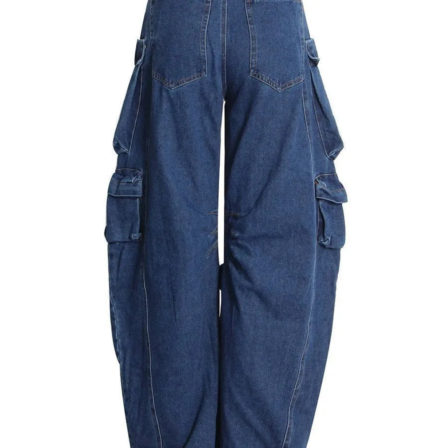 Dark blue distressed wide-leg high-waist jeans with multiple pockets on a street fashion model