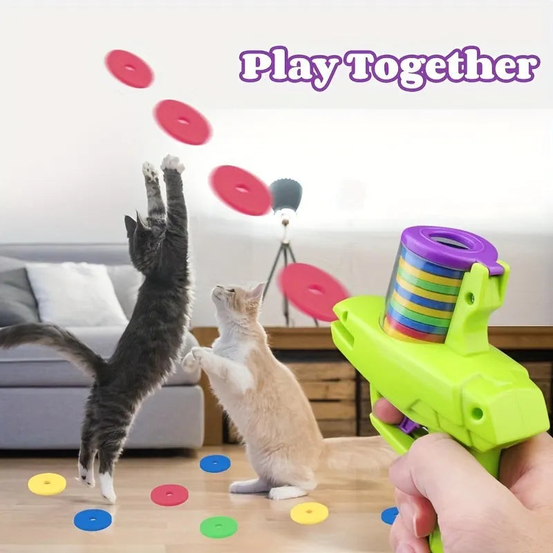 Interactive cat toy launcher with foam disc in green or purple colour options