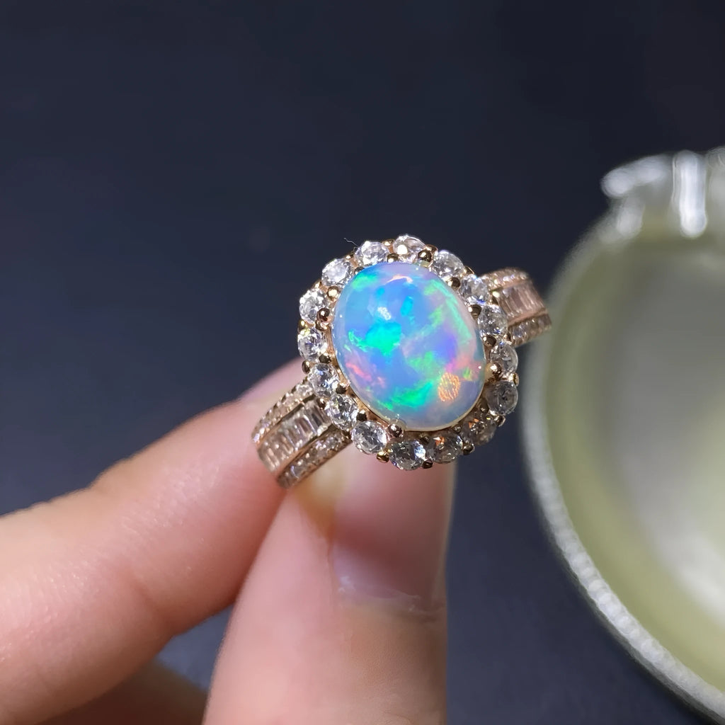 Handmade natural opal silver ring in gold colour with adjustable opening on hand
