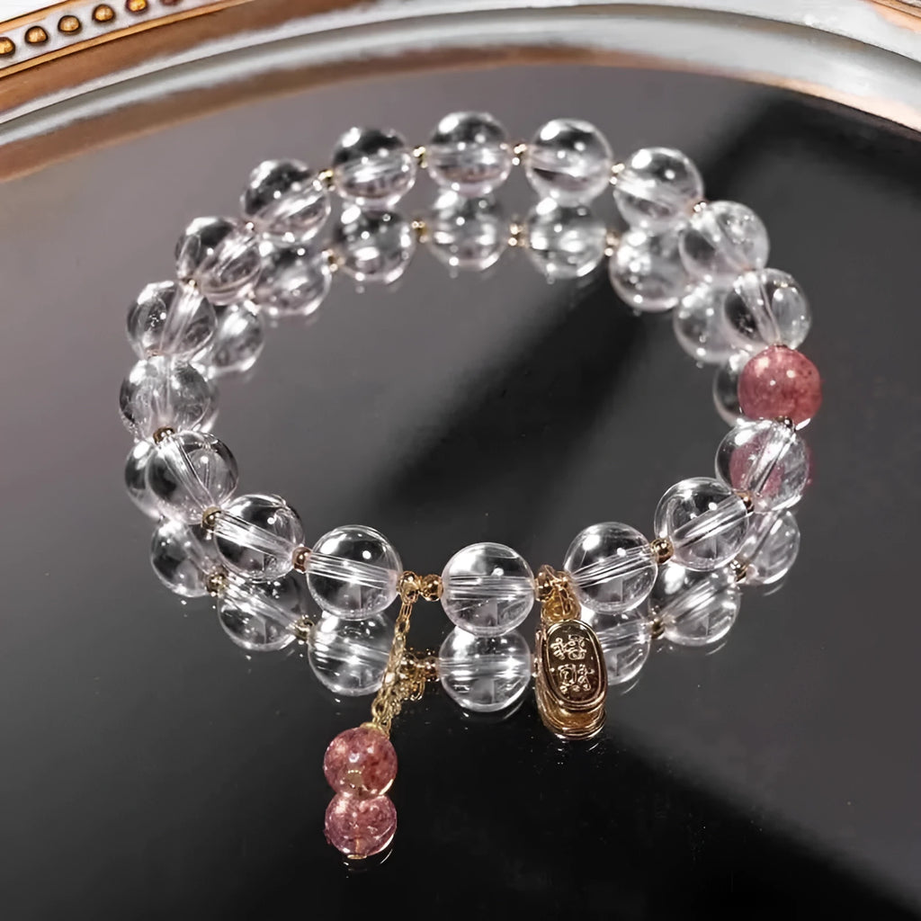 Natural white crystal lucky fortune bracelet on display with beads arranged in a U-shape on a neutral background.