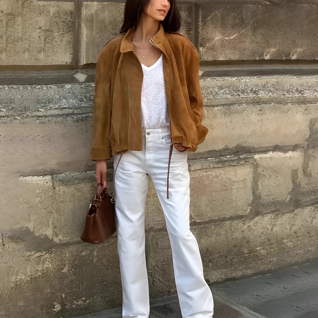Loose fit solid colour retro jacket with long sleeves on a hanger.