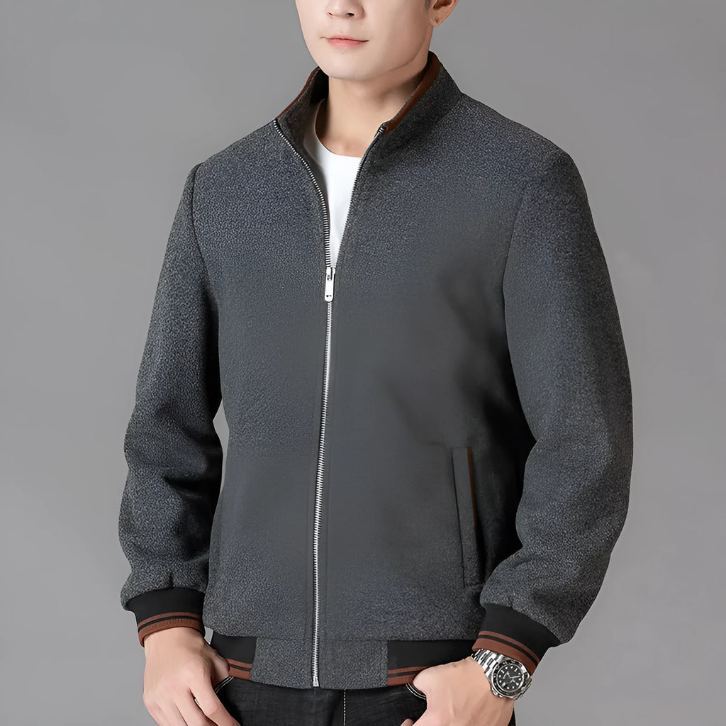 Men's grey wool fleece autumn jacket with long sleeves and a stick pocket, laid flat.