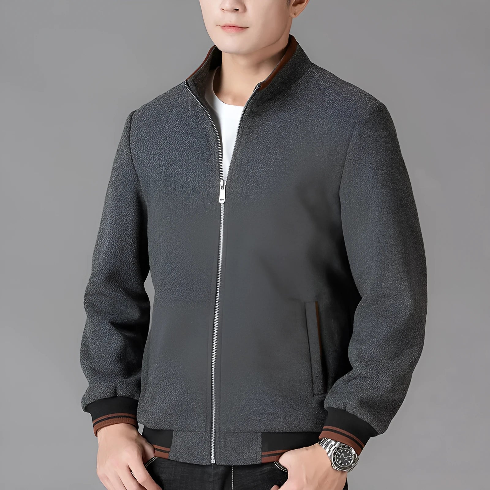 Men's grey wool fleece autumn jacket with long sleeves and a stick pocket, laid flat.