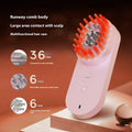 Pink and black smart massage comb for scalp care with red light therapy, measuring under 10cm.