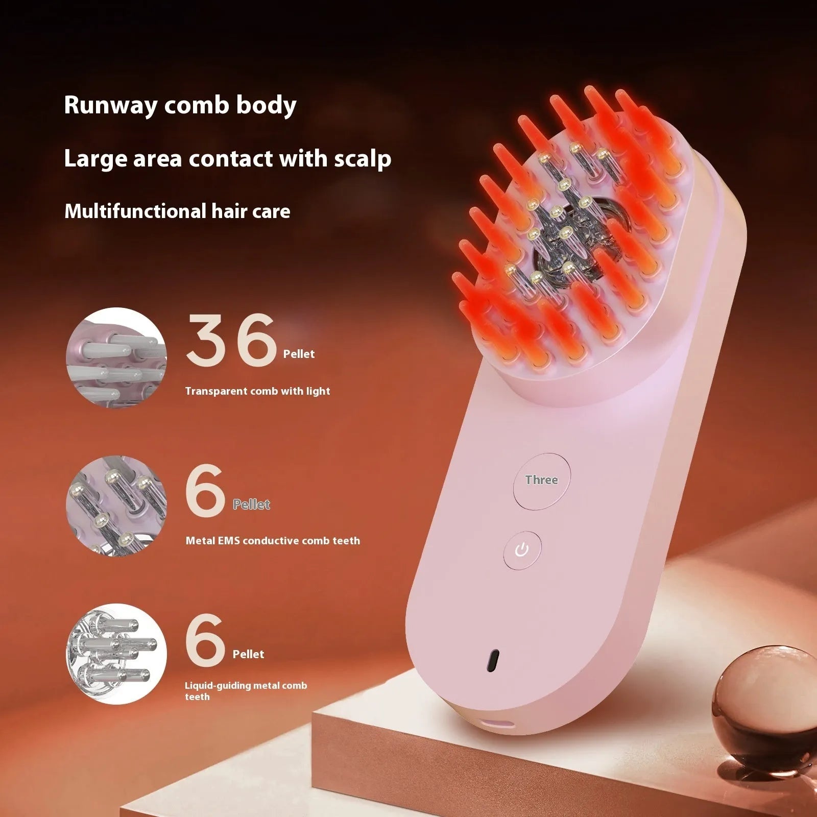 Pink and black smart massage comb for scalp care with red light therapy, measuring under 10cm.