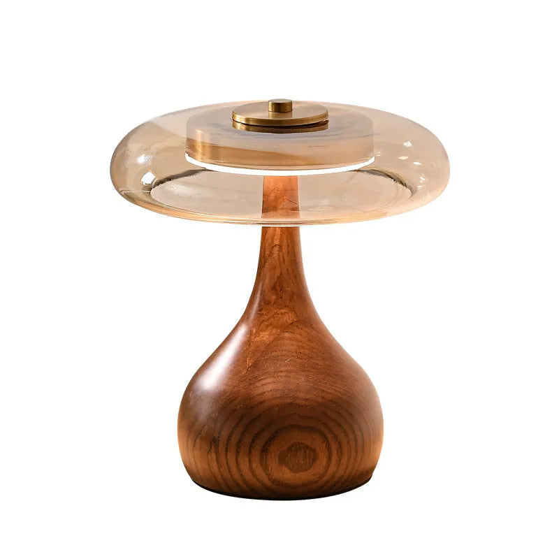 Solid ash wood bedside lamp with cognac shade and metal base on wooden table