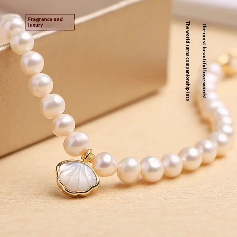 Women's freshwater pearl bracelet with fan-shaped pearl cluster and choice of elastic or chain fastening.
