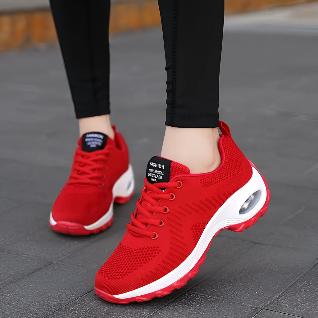 Women's round toe black mesh sneakers with white laces on a flat PU sole.