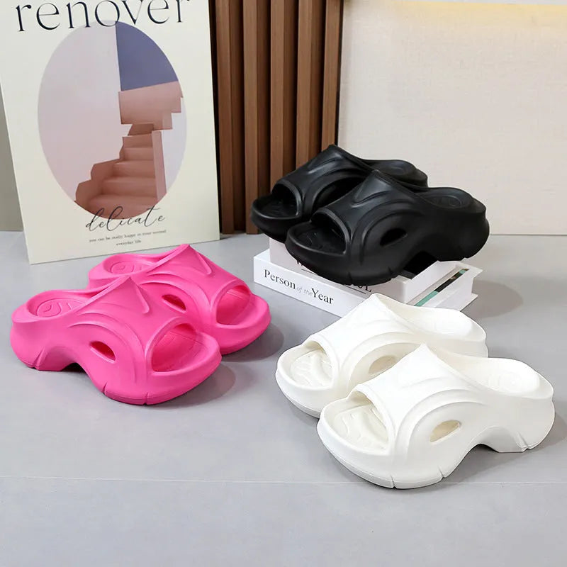 Women's white EVA beach slippers with a thick sole and round toe.