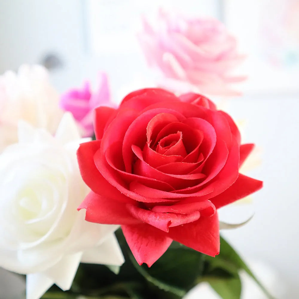Artificial silk flower bouquet measuring approximately 42cm long with 8.5cm flower heads in multiple colour options