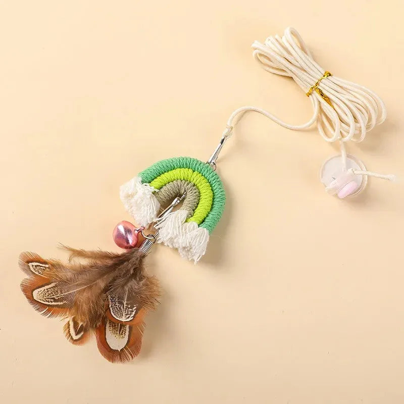 Blue feather rope cat toy with elastic cord hanging from door with sticky buckle clamp