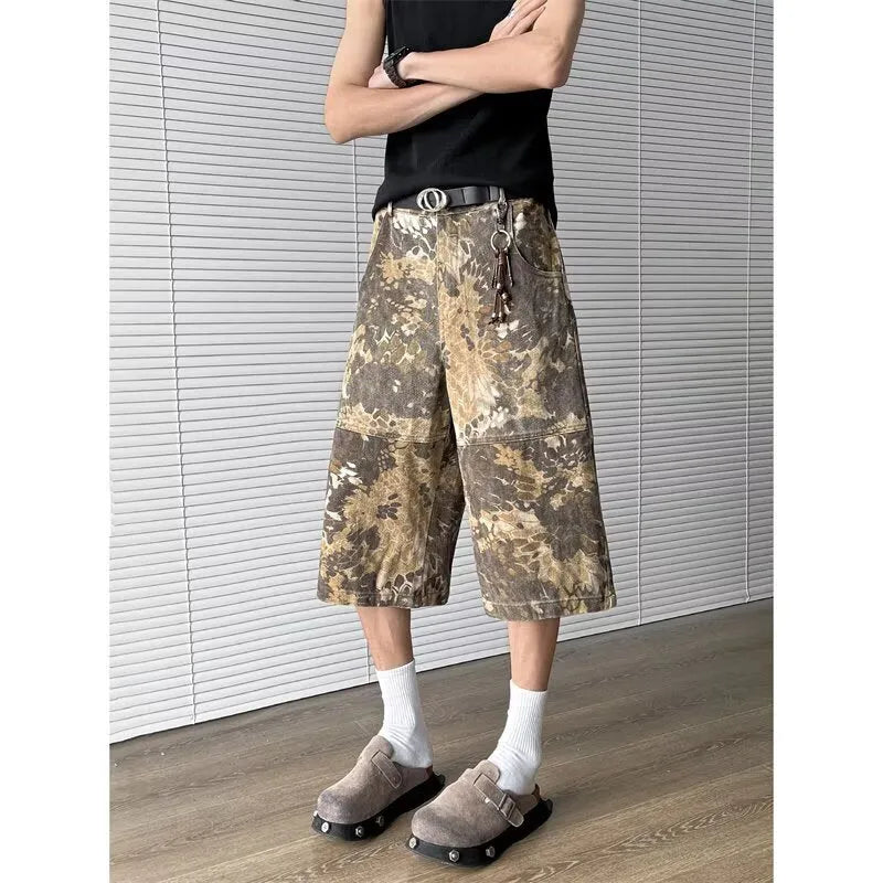 Yellow jeans with snake pattern camouflage design in cropped length
