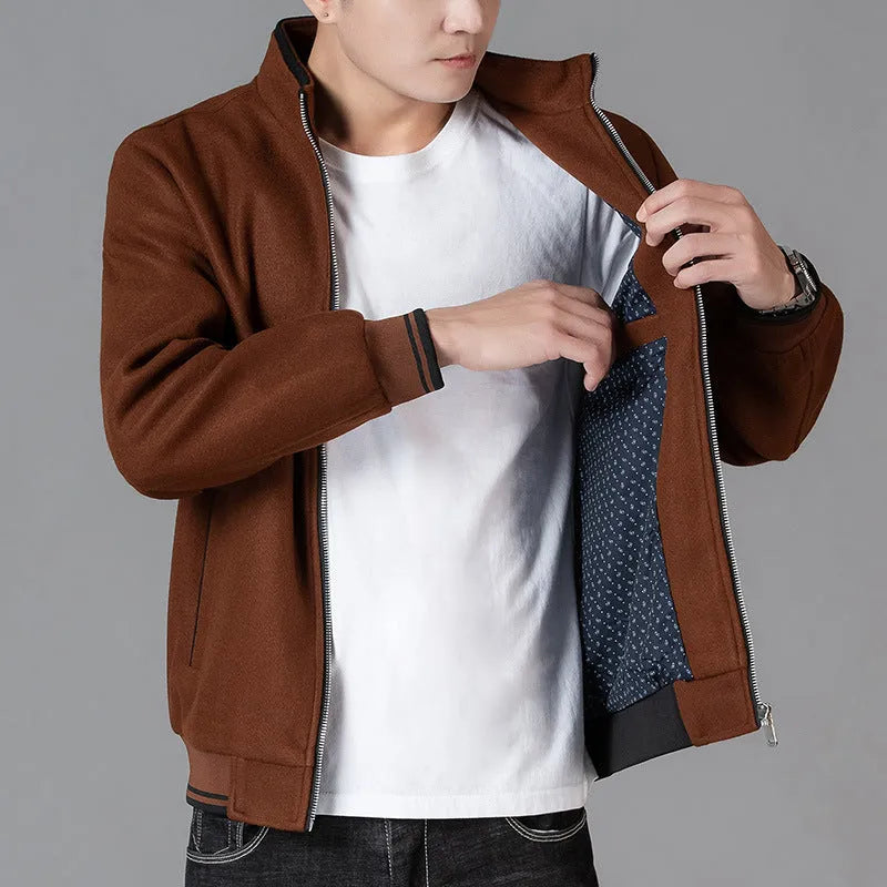 Men's grey wool fleece autumn jacket with long sleeves and a stick pocket, laid flat.