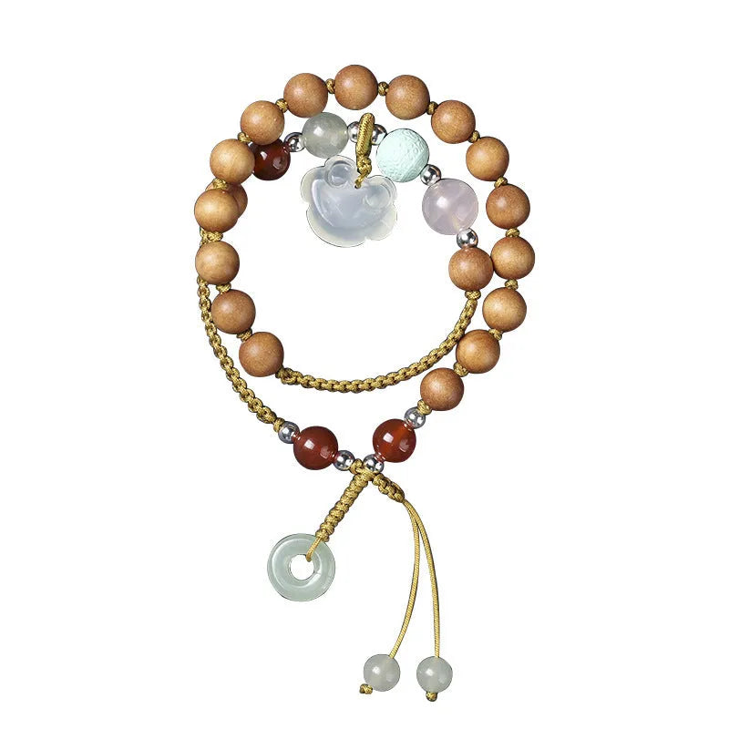 Women's ebony hand-woven double ring bracelet with Ruyi motif, available in Xiuyan jade colour