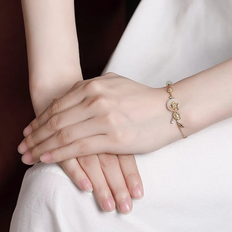 Hetian jade peace buckle bracelet in gold-plated 925 silver with lotus pattern for women