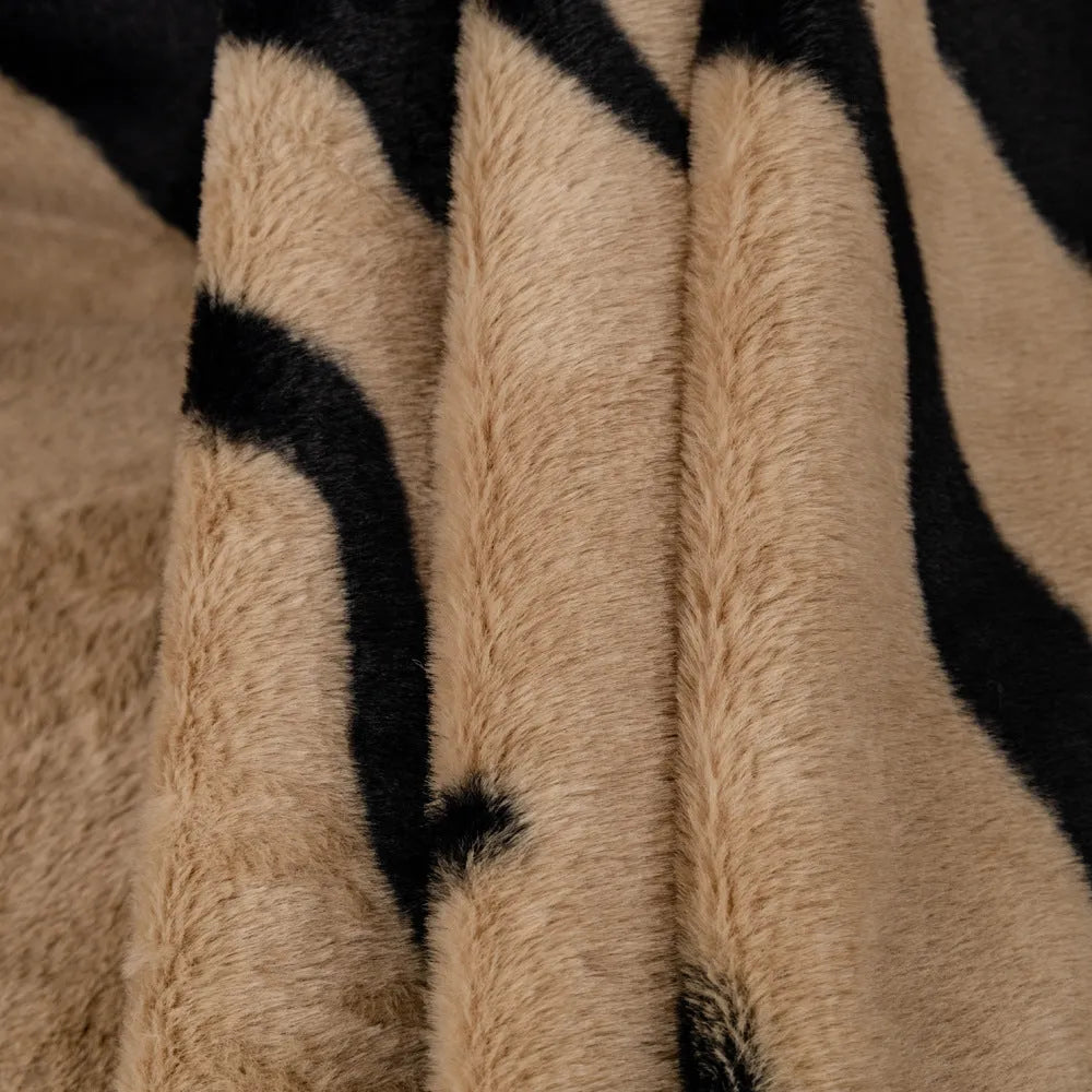 Zebra pattern flannel sofa cover in light luxury style draped over a sofa