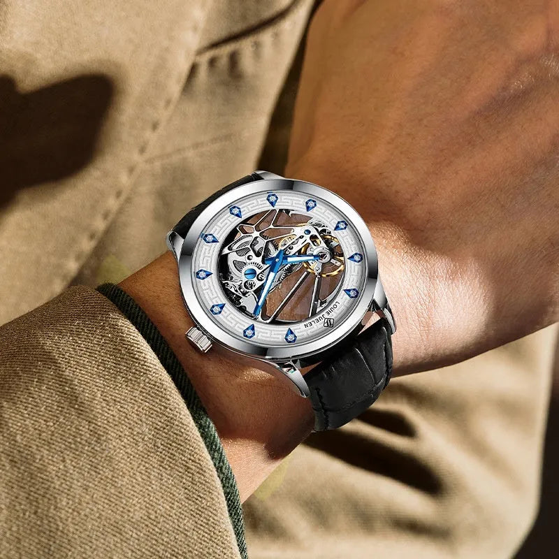 Men's silver mechanical watch with white dial, blue hands, and brown leather strap