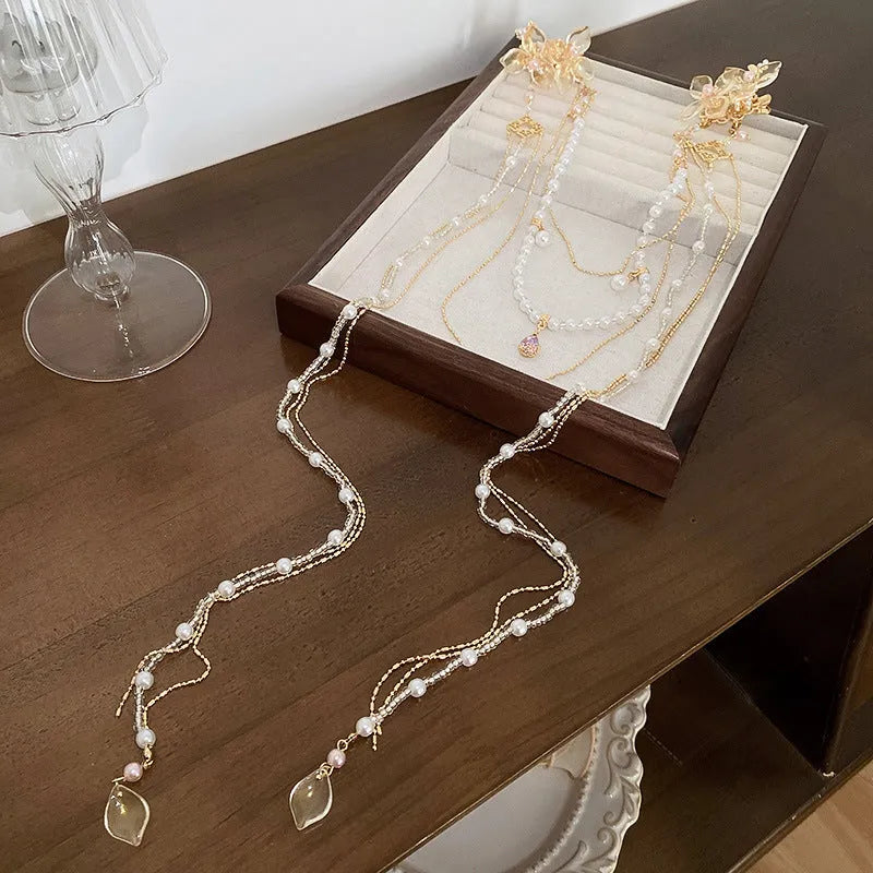 Gold women's hairpin with pearl, diamond and flower decoration and long tassel