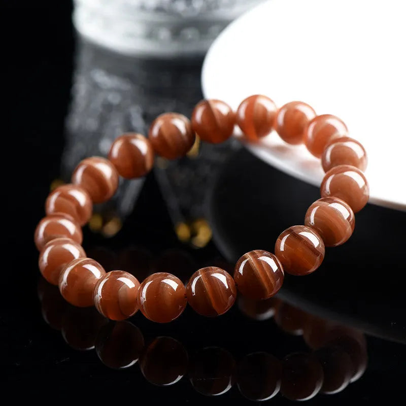 Natural Peruvian old mine rhodochrosite round bead bracelet with geometric design