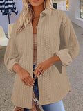 Women's black solid colour long-sleeved knitted cardigan sweater laid flat