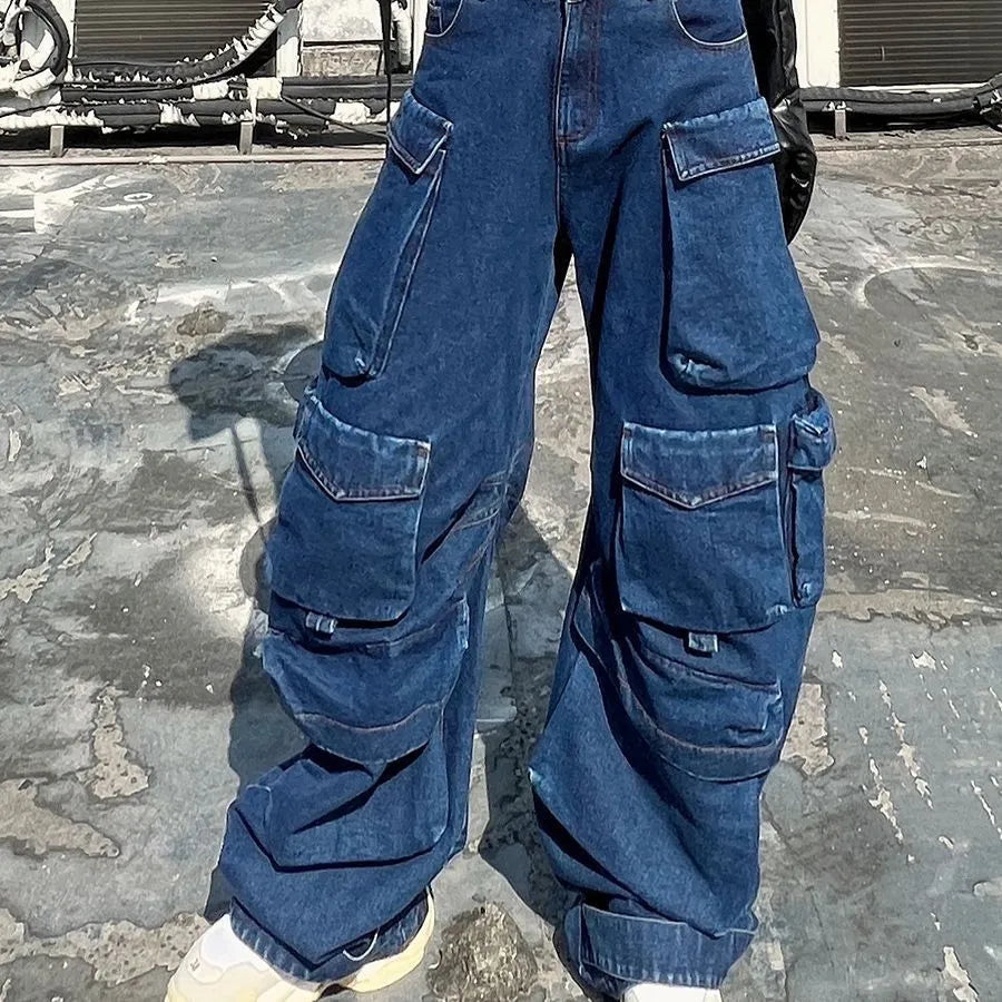 Dark blue distressed wide-leg high-waist jeans with multiple pockets on a street fashion model