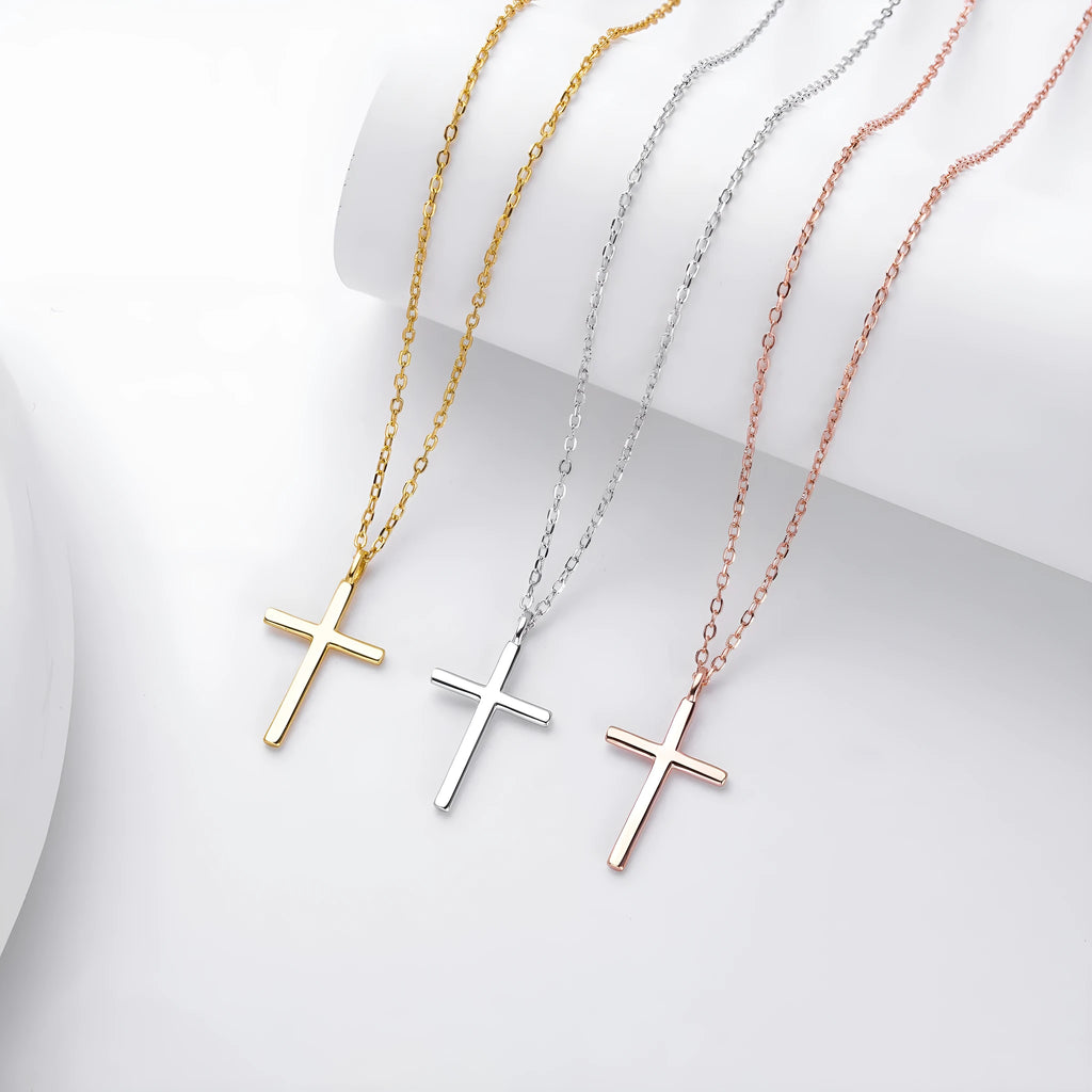 Simple glossy cross pendant on a sterling silver O-chain necklace.