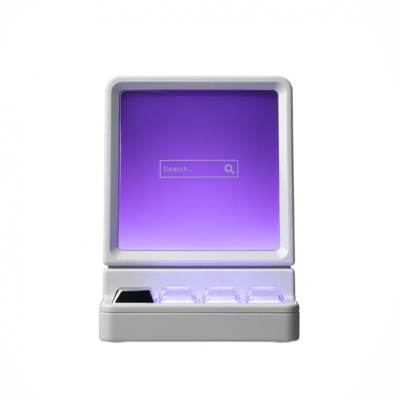 Portable classic computer-shaped Bluetooth speaker in light gray with lighting and voice prompt on a desktop