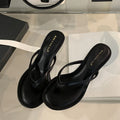 Women's open-toed stiletto sandals with flat head, rubber sole, in classic black, side view