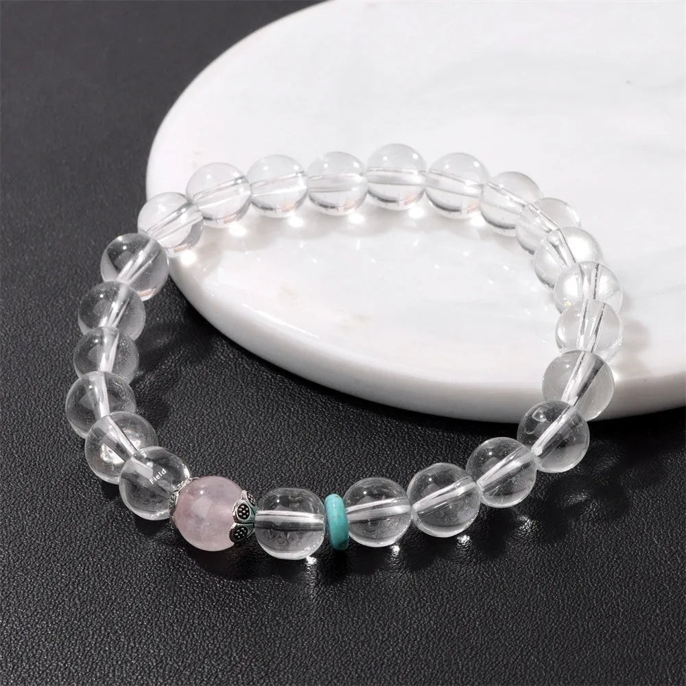 Natural white crystal lucky fortune bracelet on display with beads arranged in a U-shape on a neutral background.