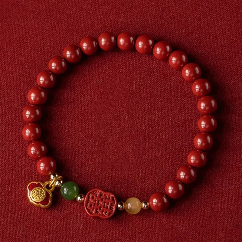 Happy Eyebrow Bracelet with fu character charm in cinnabar emperor sandstone beads.