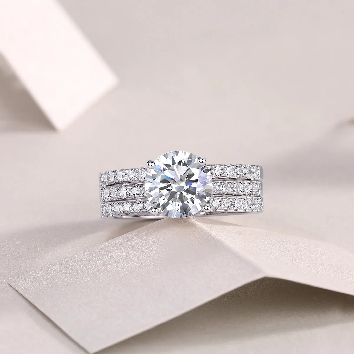 Dreamy 2-carat moissanite wedding ring set on white background, S925 silver platinum-plated band