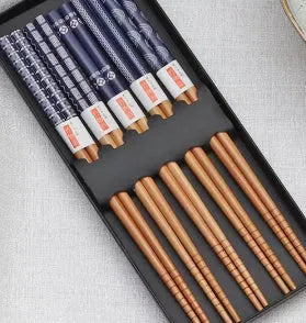 Five pairs of bamboo chopsticks with colourful Japanese lucky cat cartoon design.