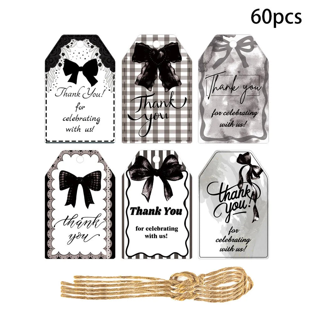 Bowknot-shaped paper gift tags with natural hemp rope ties for birthday party decoration