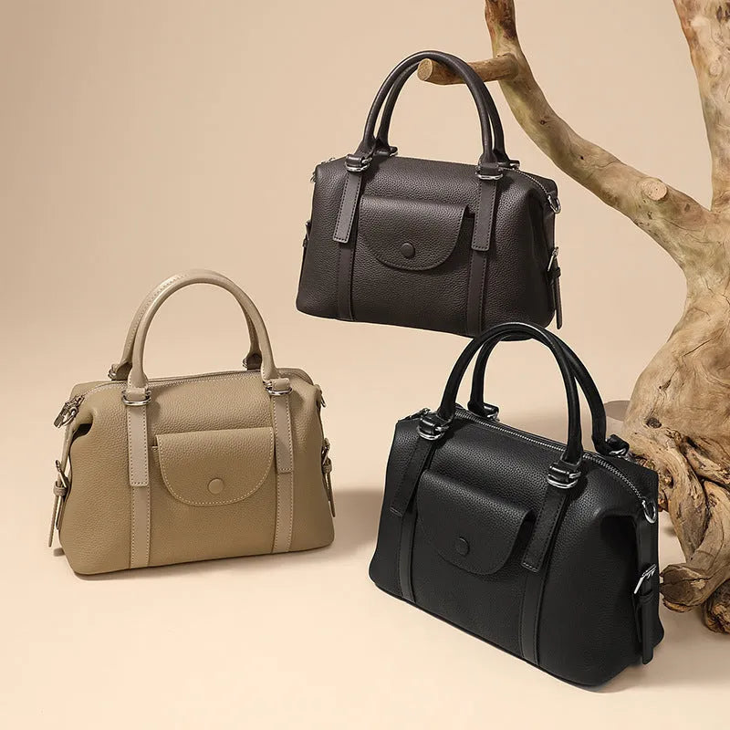 Genuine leather ladies handbag in black with contrast stitching and lock hardware