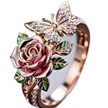 Adjustable butterfly ring with colourful oil drip finish showing floral and insect modelling in alloy metal