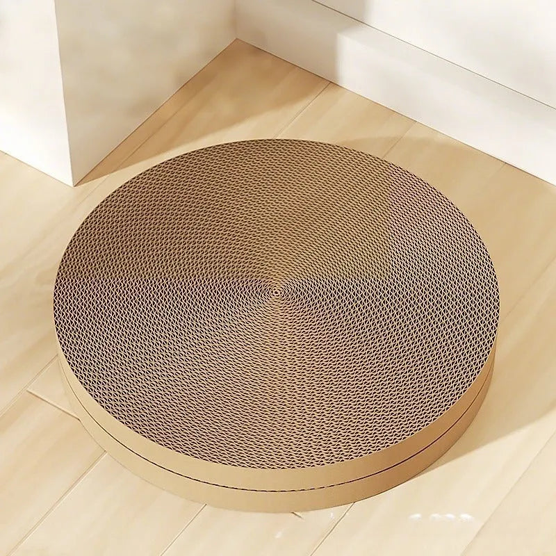 Round cat scratching board made from corrugated paper with green surface and two replacement pads on the side