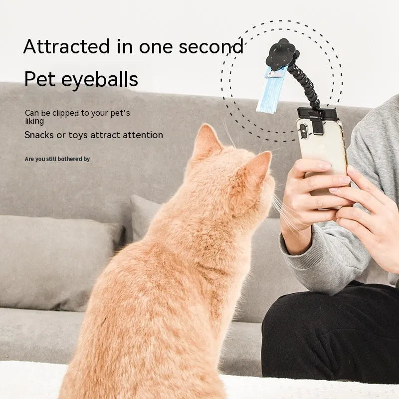 Pet photography tool with black plastic phone clip and snack holder for dog selfies