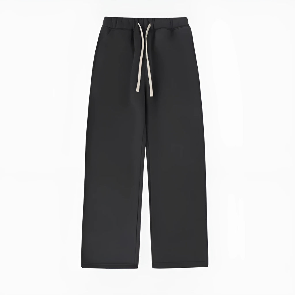 Man wearing thick black fleece-lined sweatpants with an elastic drawstring waist.