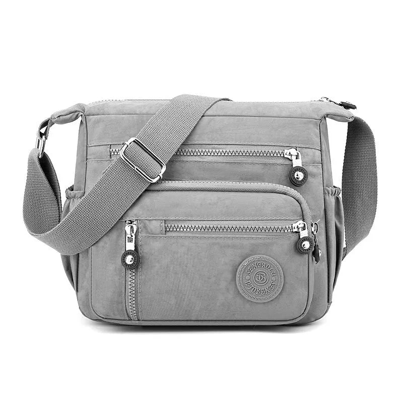 Nylon messenger bag with square vertical shape in one of five colour options